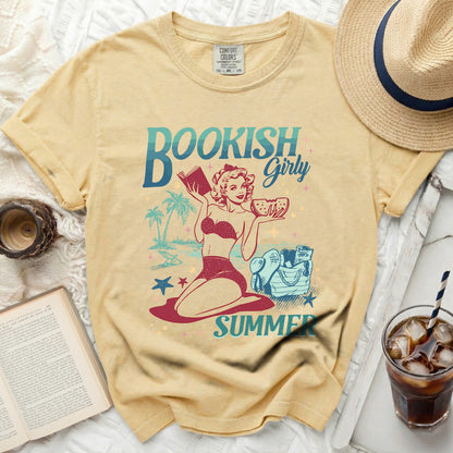 "Bookish Girl" graphic tee with vintage style illustration on yellow shirt.