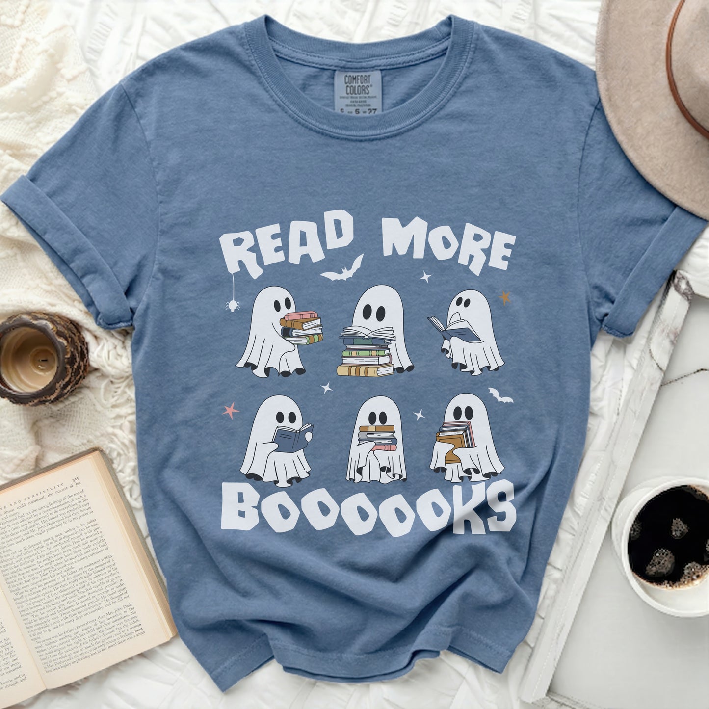 Blue shirt with "READ MORE BOOOOOKS" and ghosts reading books graphic.