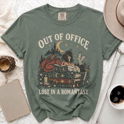 Green t-shirt with "Out of Office Lost in a Romantasy" graphic featuring a dragon and castle.