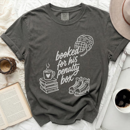 Dark gray t-shirt with "booked for his penalty box" text and hockey imagery.
