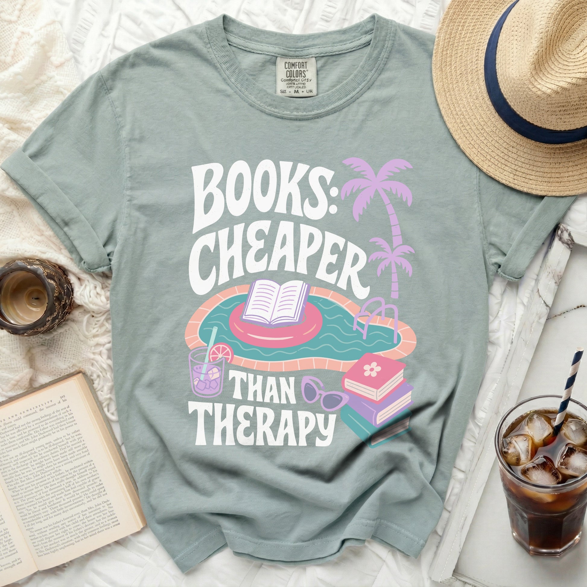Green t-shirt with "Books: Cheaper Than Therapy" and pool graphic.