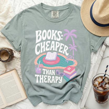 Green t-shirt with "Books: Cheaper Than Therapy" and pool graphic.