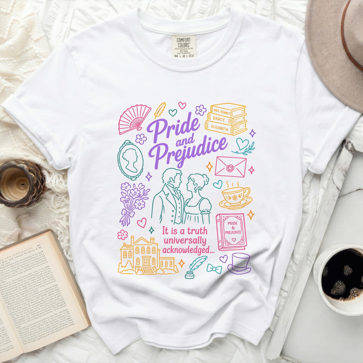 White t-shirt with "Pride and Prejudice" illustrated design and quote.