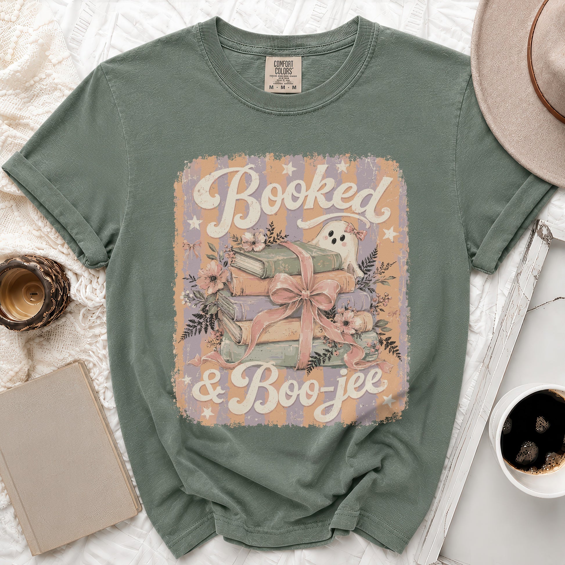 Green t-shirt with "Booked & Boo-jee" text and a ghost and books graphic.