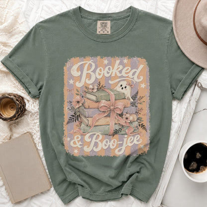 Green t-shirt with "Booked & Boo-jee" text and a ghost and books graphic.