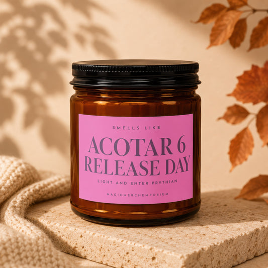 Brown candle with pink label reading "ACOTR 6 RELEASE DAY".