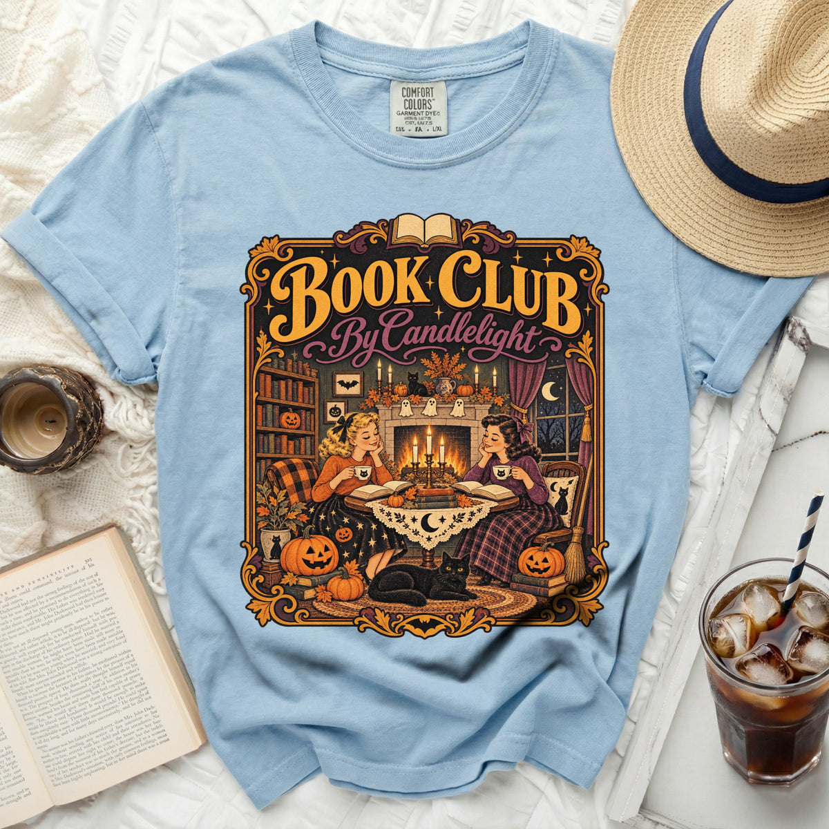 Light blue t-shirt with "Book Club By Candlelight" Halloween-themed graphic.