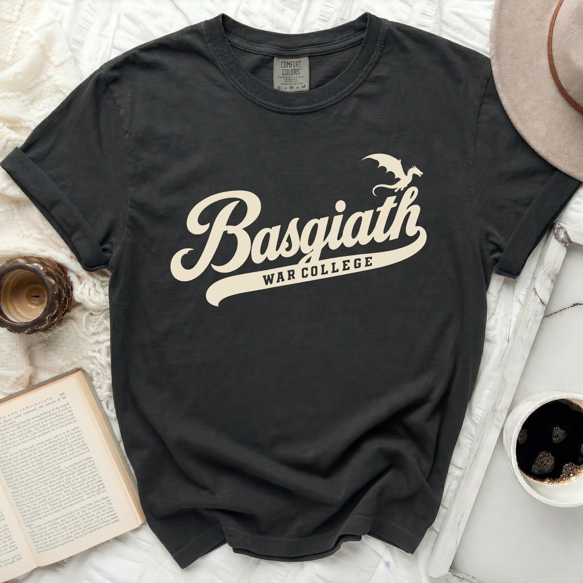 Dark grey t-shirt with cream "Basgiath War College" text and dragon graphic.