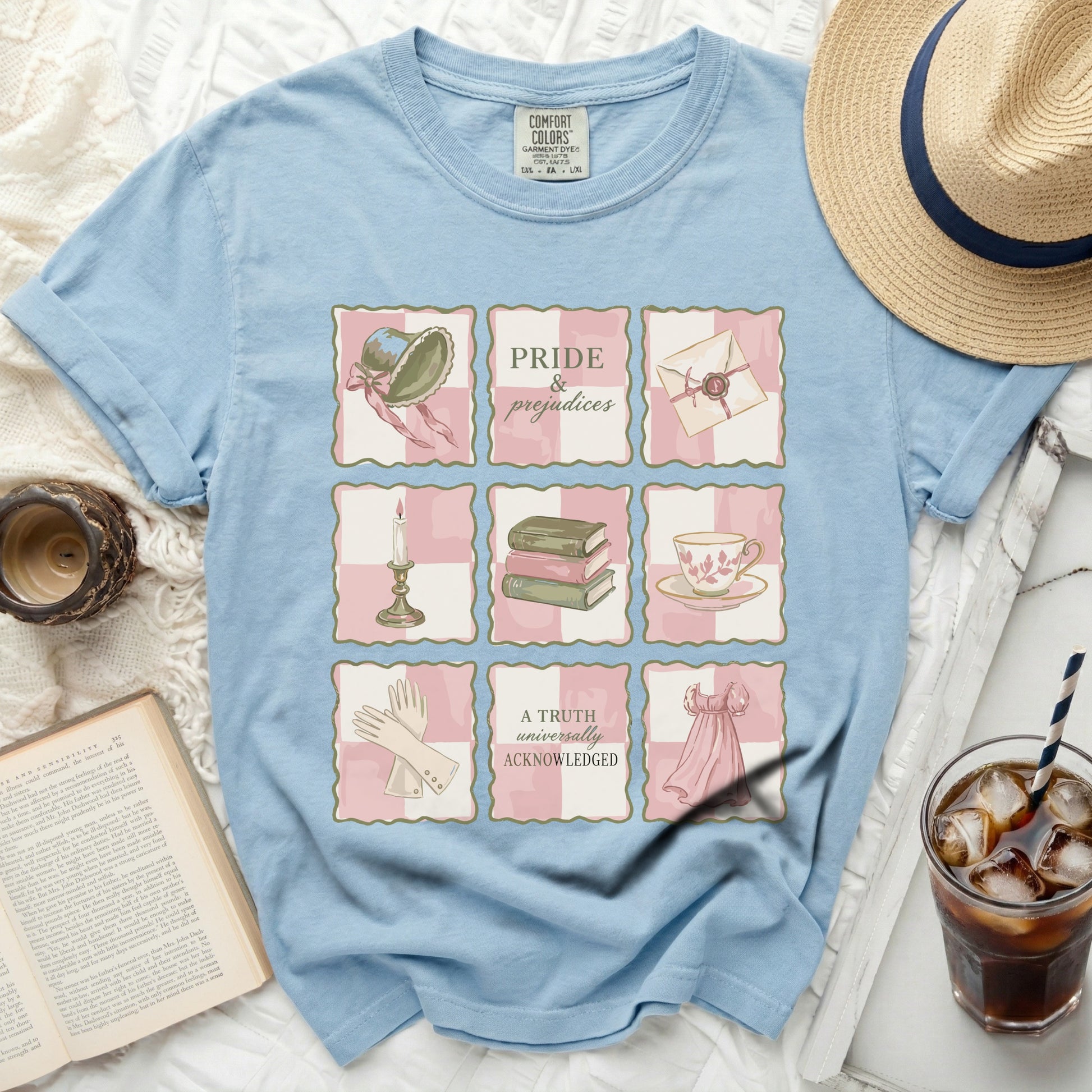 Light blue t-shirt with "Pride & Prejudices" print and literary illustrations.