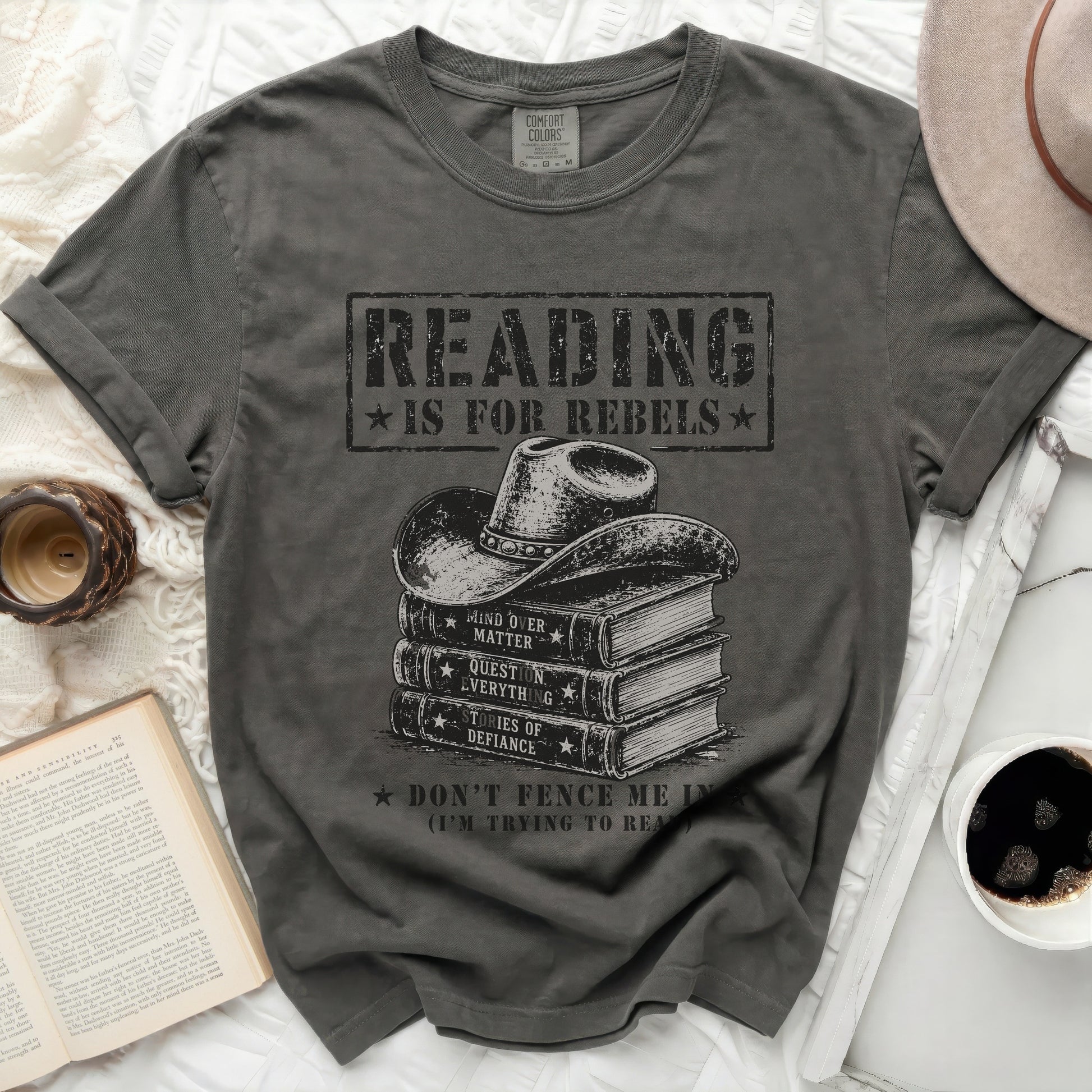 Dark gray t-shirt with "Reading Is For Rebels" and cowboy hat over books graphic.