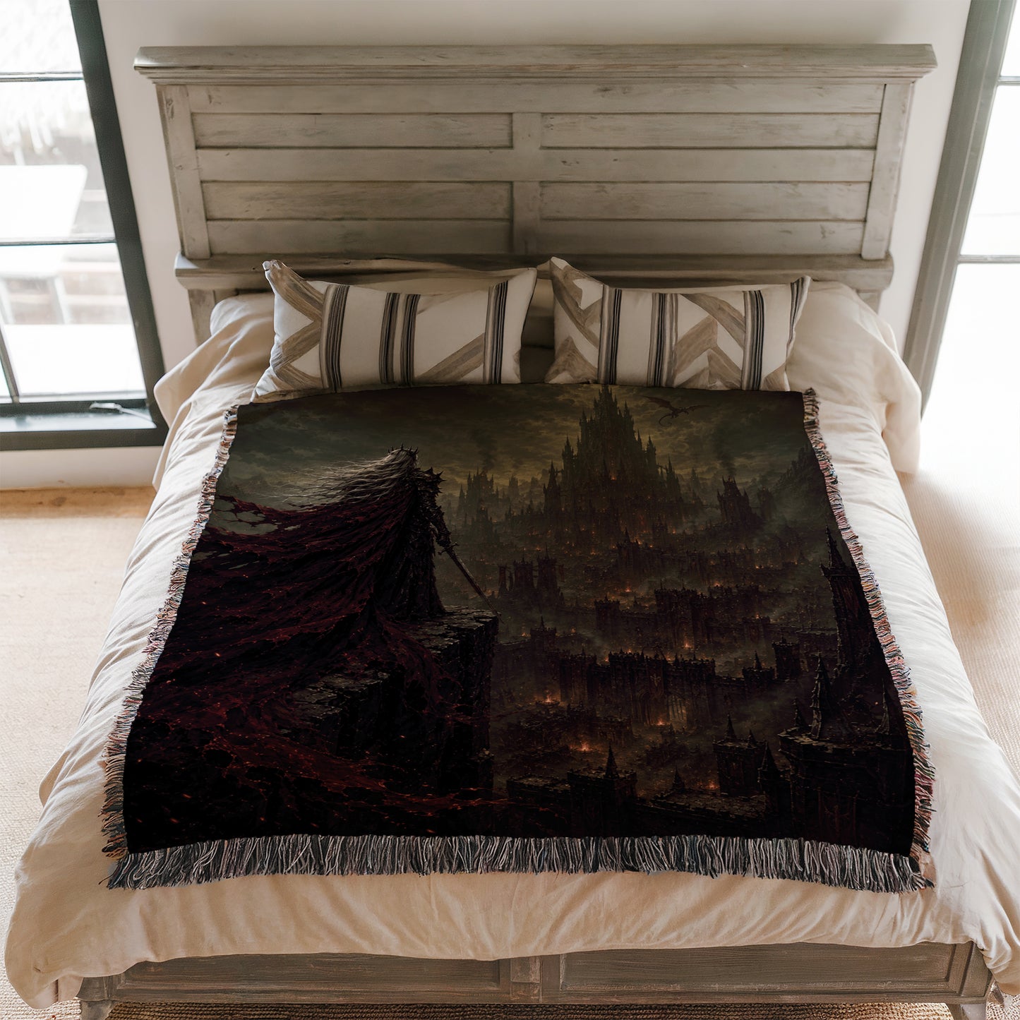 a bedroom with a bed covered in a large, dark-colored blanket that depicts a fantasy cityscape.