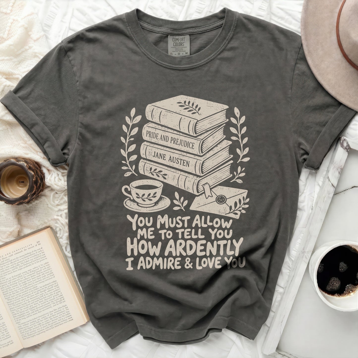 Dark grey t-shirt with stacked books, teacup, and quote about admiration.