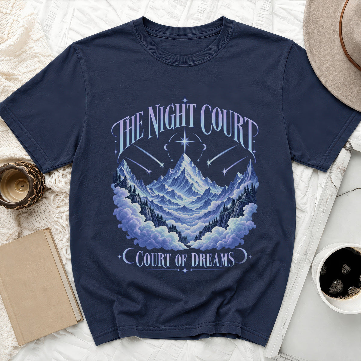 Navy t-shirt with "The Night Court Court of Dreams" text and mountain landscape graphic.