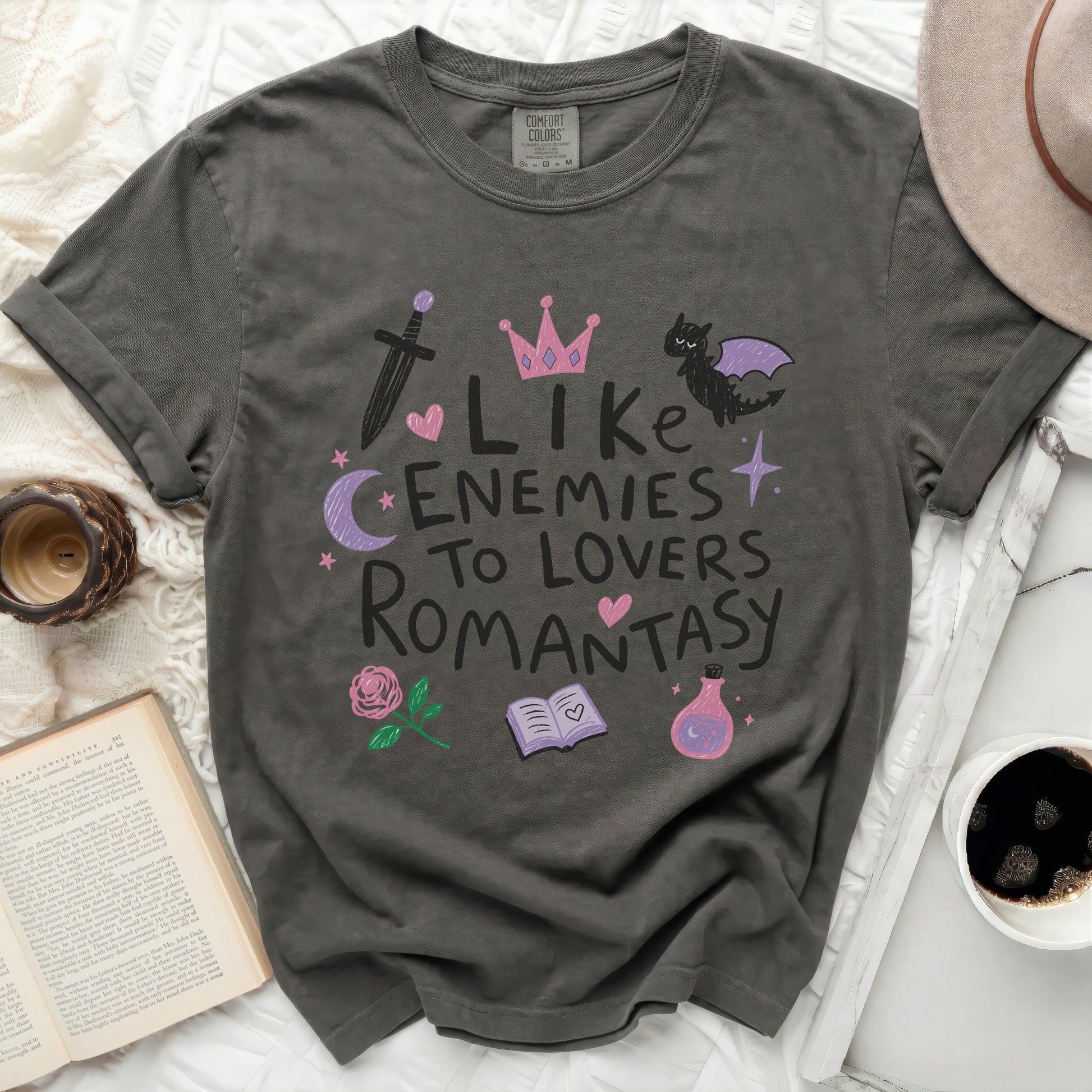 Dark grey "Comfort Colors" t-shirt with "Like Enemies To Lovers Romantasy" text and illustrations.
