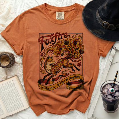 Orange t-shirt with "Foxfire" design of a fox in flames and text.