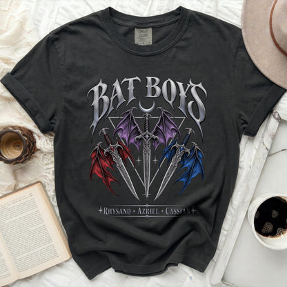 Dark gray t-shirt with "Bat Boys" text and three swords with wings, names below.