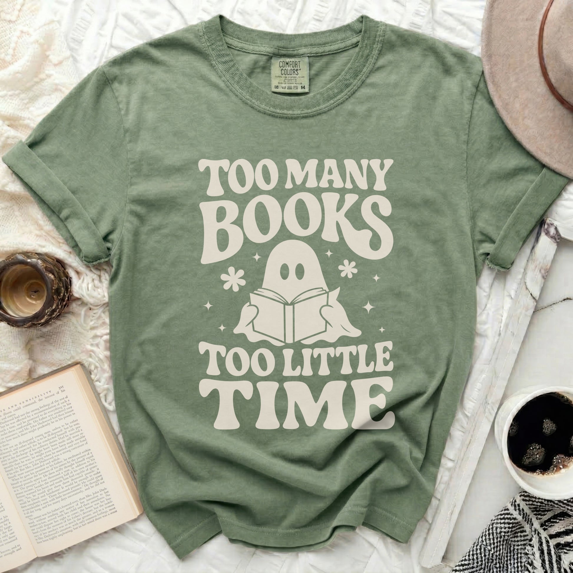 Green t-shirt with "Too Many Books Too Little Time" and a ghost reading a book.