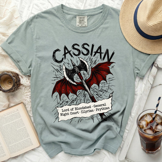 Light blue t-shirt with "Cassian" and an axe with wings, Lord of Bloodshed text.