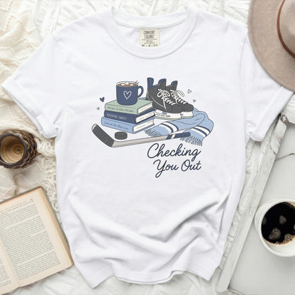 White t-shirt with hockey skates, books, and "Checking You Out" text.