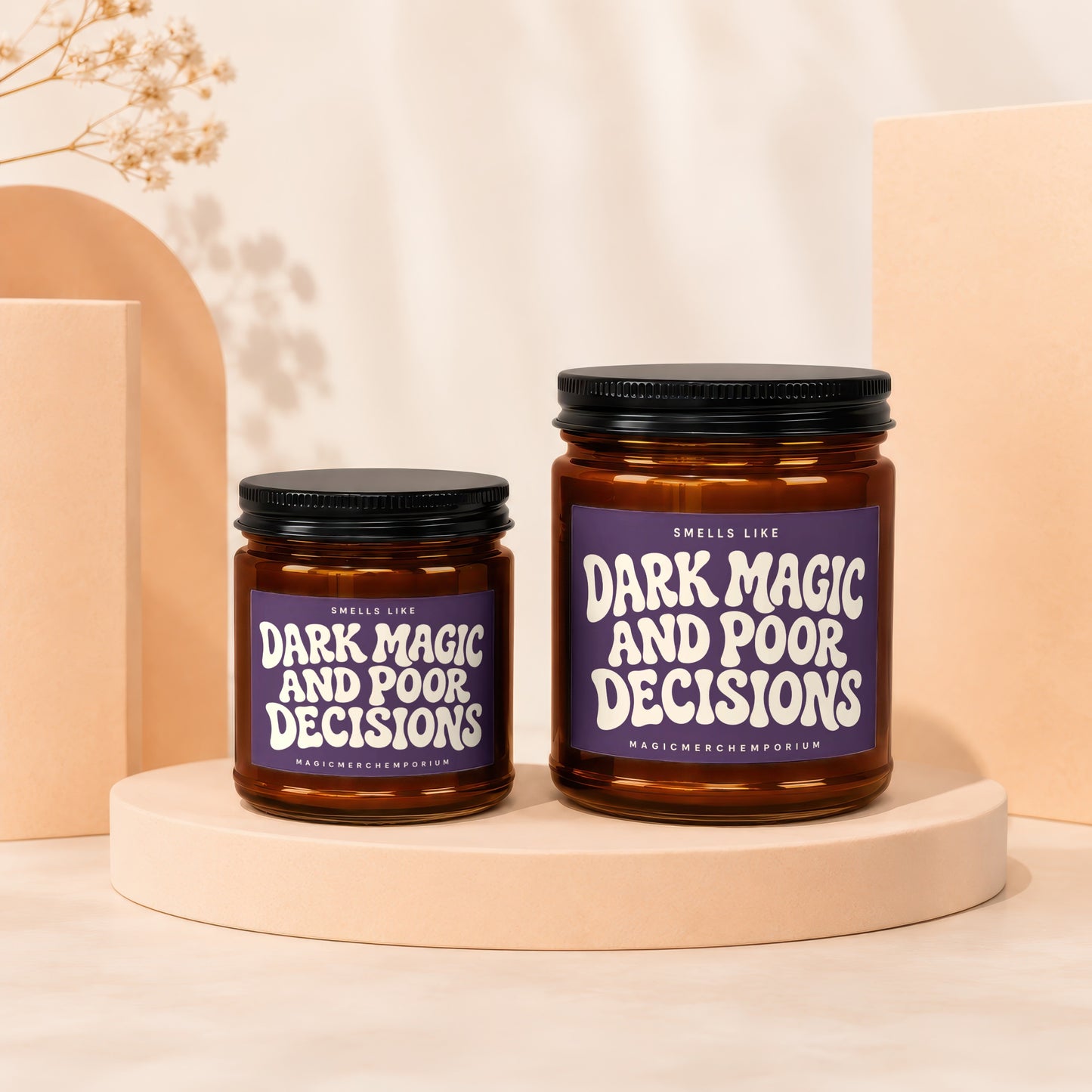 Two amber glass candles with purple labels reading "Dark Magic and Poor Decisions."