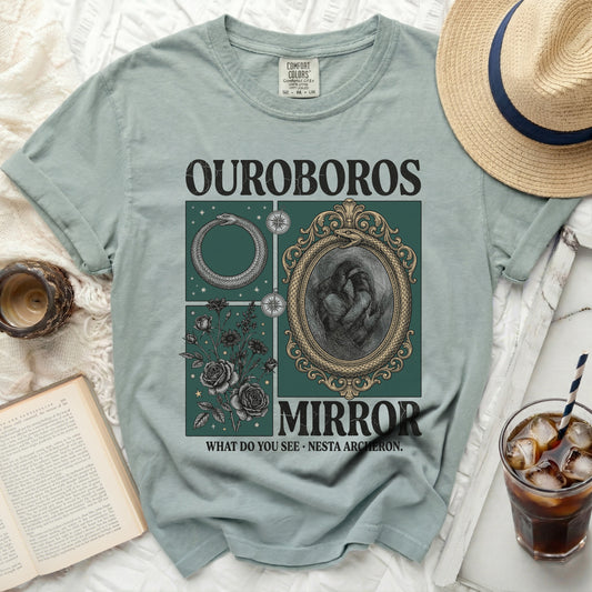 Shirt with Ouroboros, mirror, and floral design, says Ouroboros Mirror.