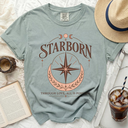Blue t-shirt with "STARBORN" and "THROUGH LOVE, ALL IS POSSIBLE." text.