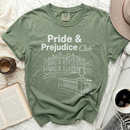 Green t-shirt with "Pride & Prejudice Club" and a house design.