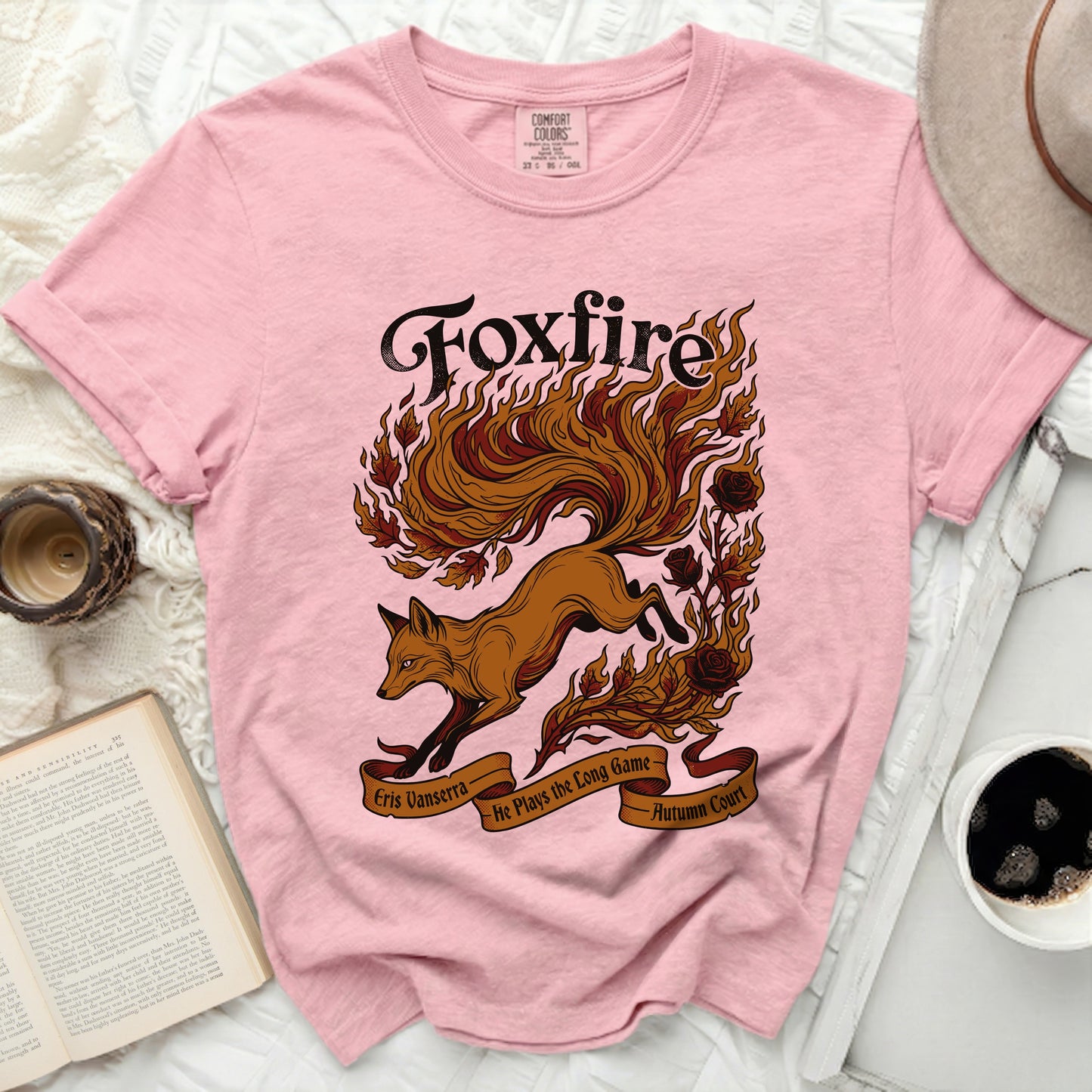 Pink t-shirt with a fox and roses graphic and text "Foxfire Eris Vanserra He Plays the Long Game Autumn Court".