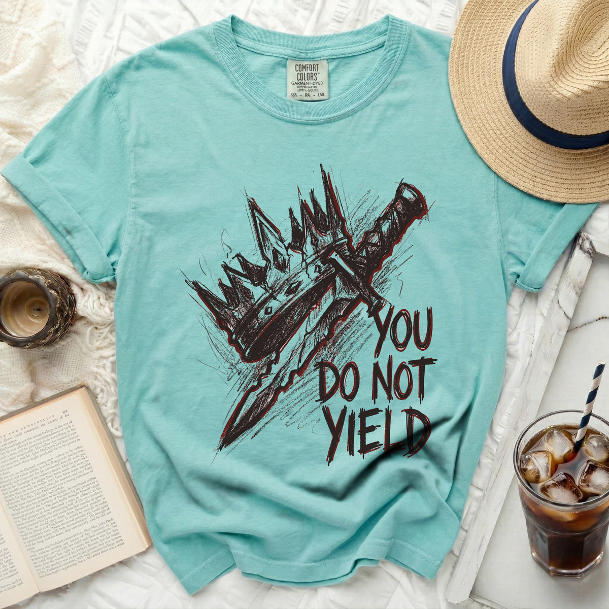 Teal t-shirt with black and red sketch of crown, sword, and "YOU DO NOT YIELD" text.
