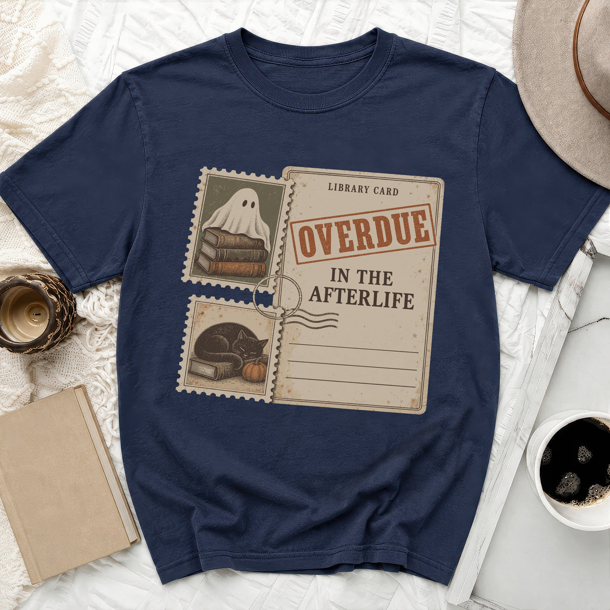 Navy t-shirt with "Overdue In The Afterlife" library card graphic and stamp designs.