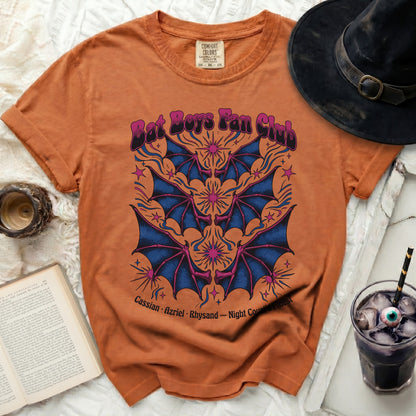 Orange t-shirt with "Bat Boys Fan Club" and bat wing graphic.