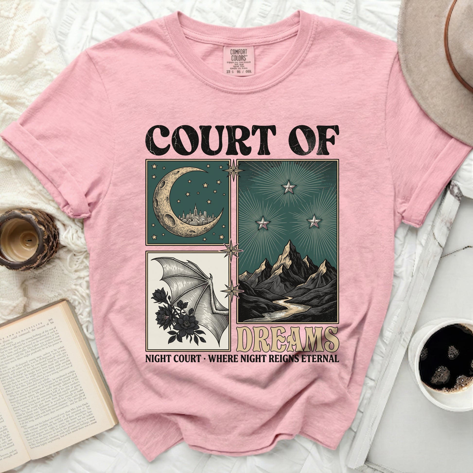 Pink t-shirt with "COURT OF DREAMS" and night-themed graphic.