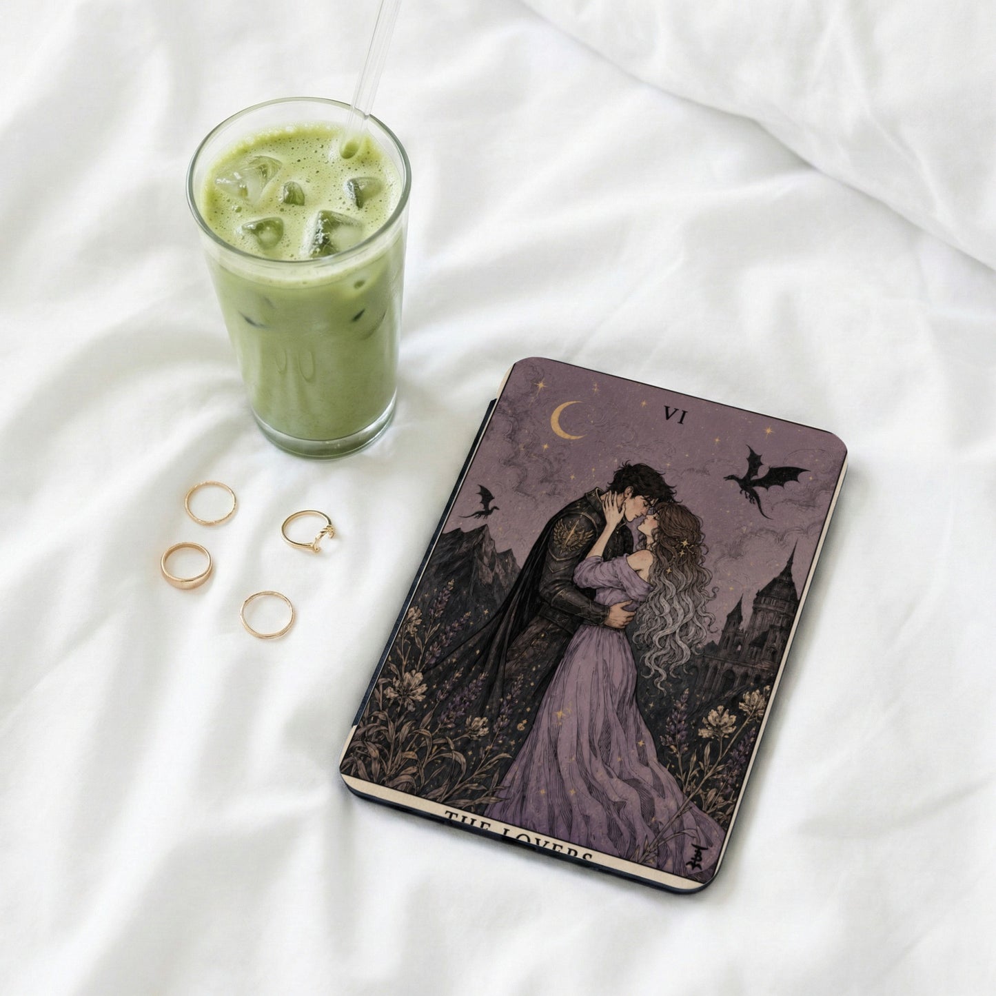 The Lovers tarot card features a couple kissing, a castle, and a dragon.