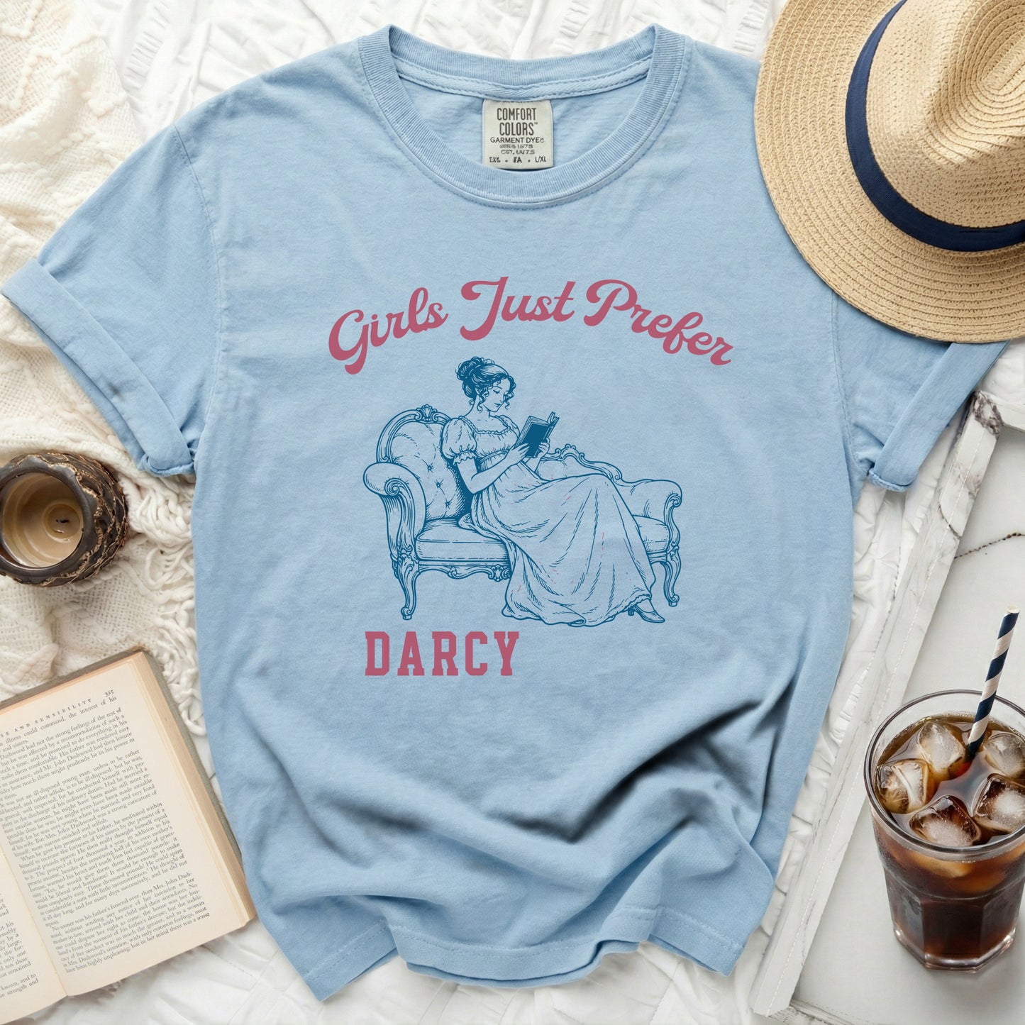 Light blue t-shirt with "Girls Just Prefer Darcy" and a line drawing.
