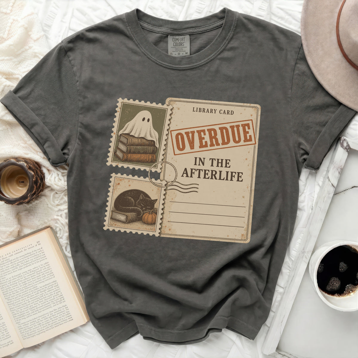 T-shirt with a library card graphic reading "Overdue in the Afterlife."