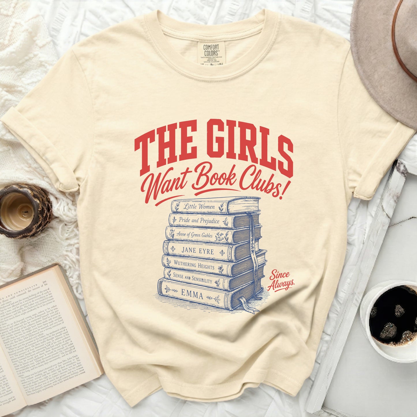 Cream t-shirt with "The Girls Want Book Clubs!" and book titles.