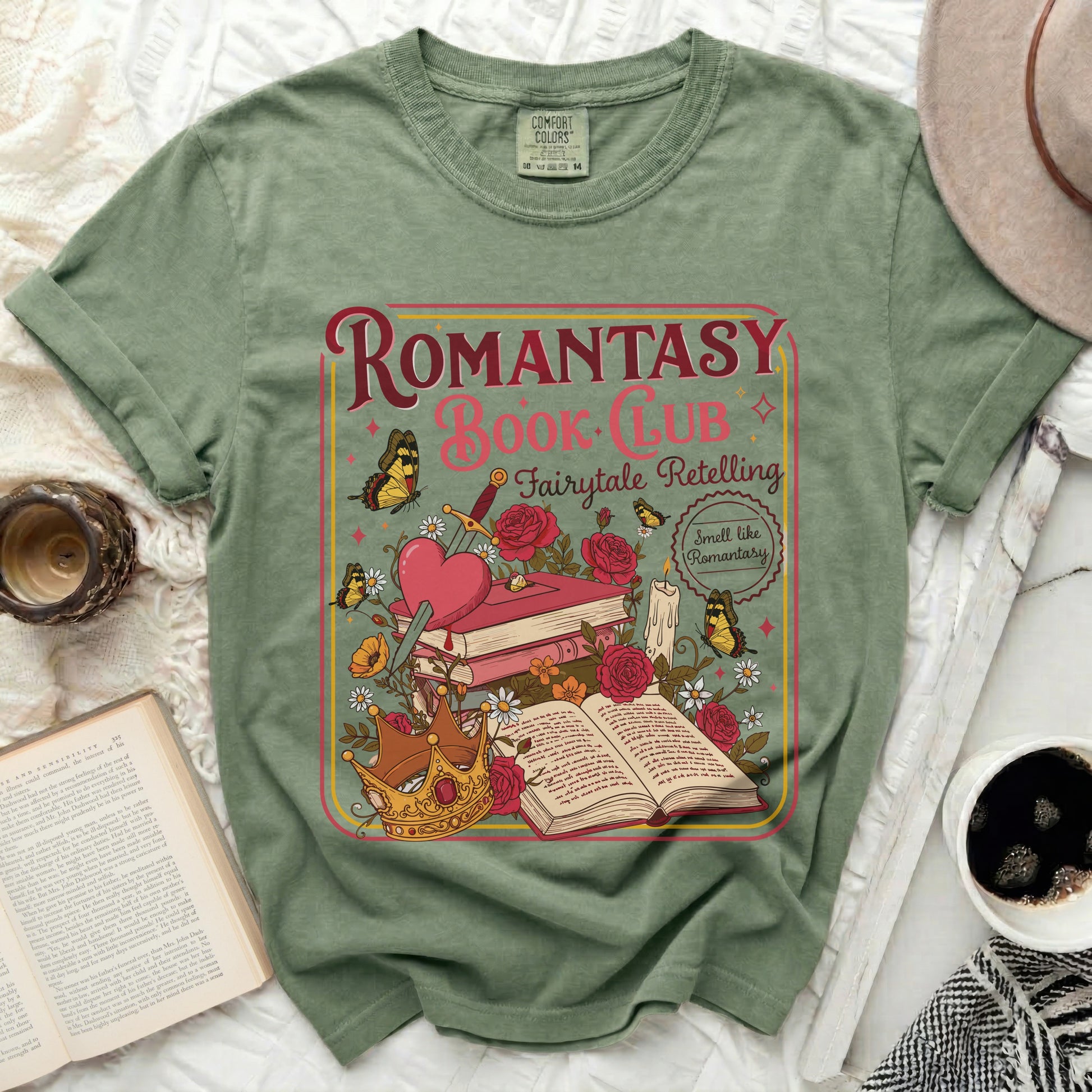Green t-shirt with Romantasy Book Club graphic featuring books, sword, crown, roses, and butterflies.