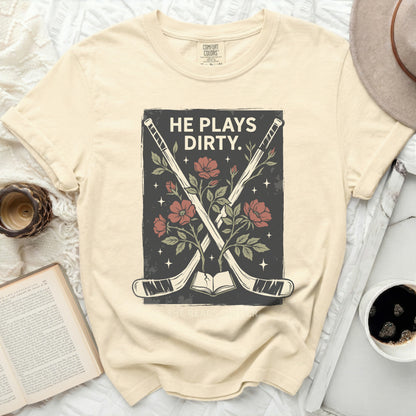 Cream t-shirt with crossed hockey sticks and floral design.