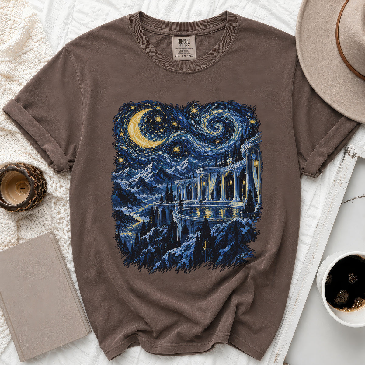 Brown t-shirt with a starry night landscape and castle print.