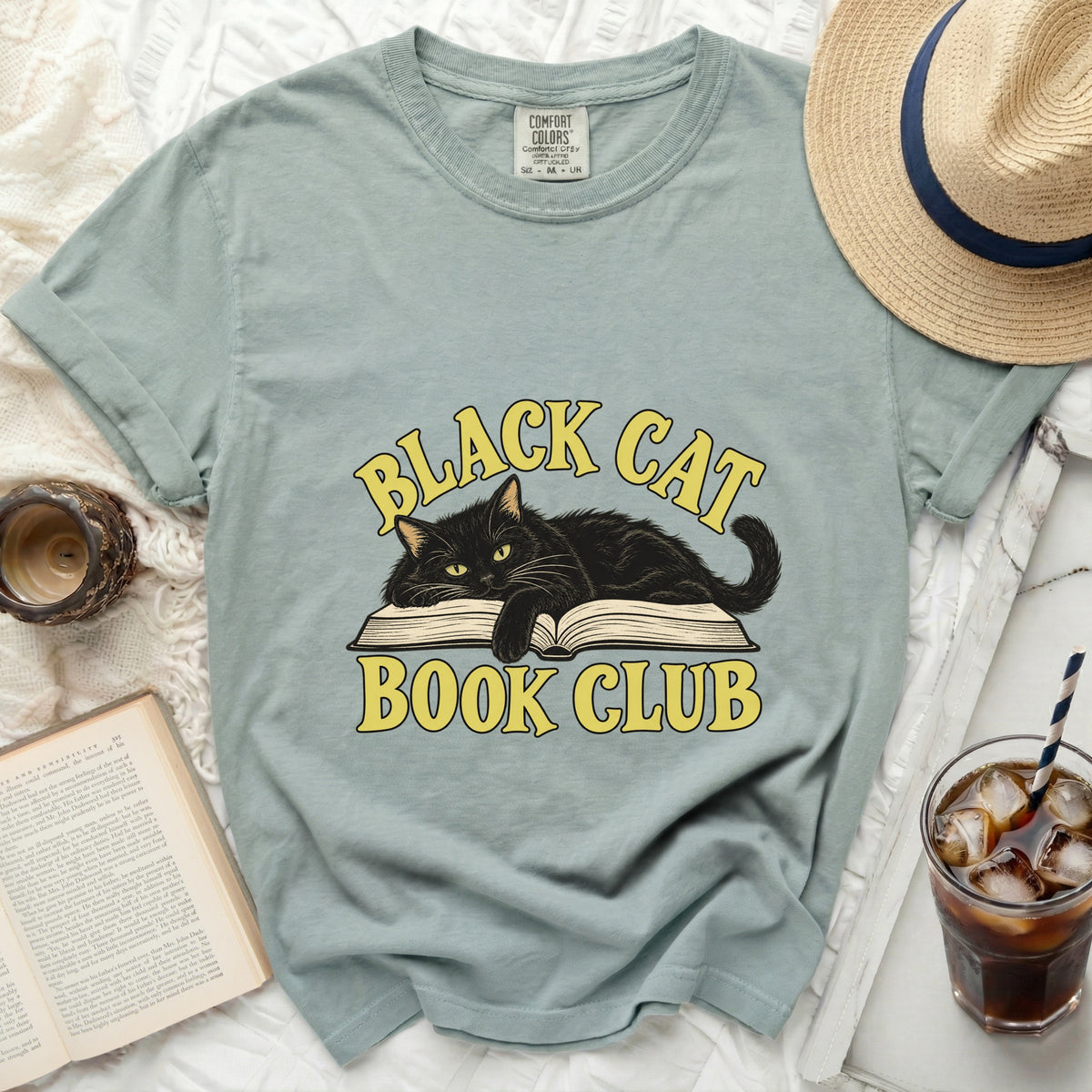 Light blue t-shirt with black cat and "Black Cat Book Club" text.