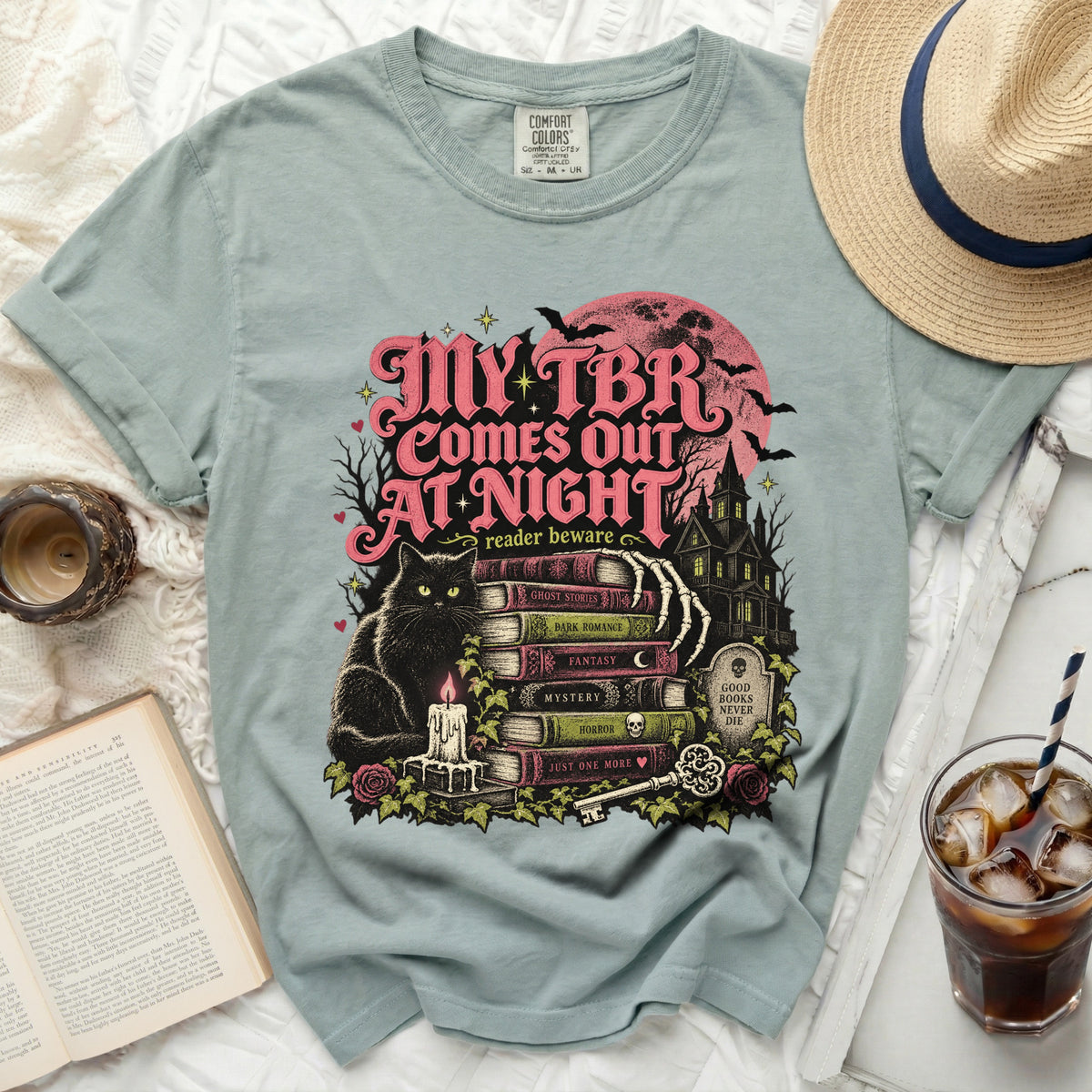 My TBR Comes Out At Night graphic t-shirt with black cat and books.