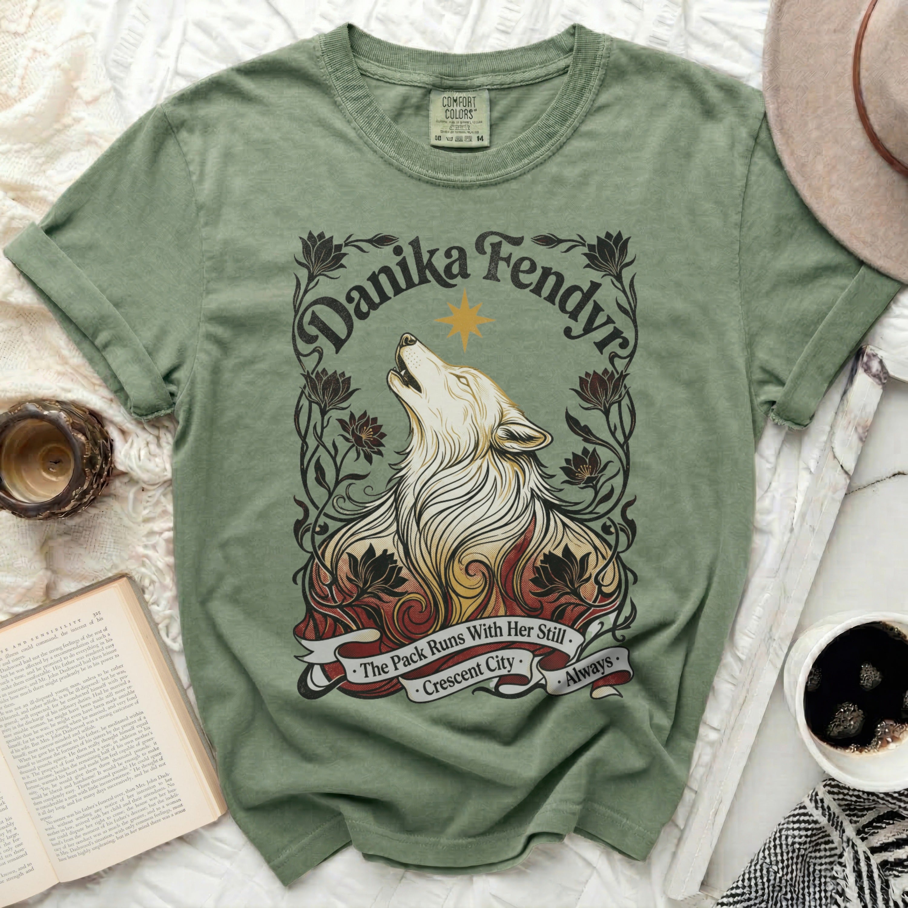 Green t-shirt with wolf and floral graphic and text 
