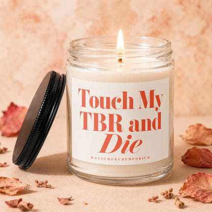 Candle with lid beside it, featuring text "Touch My TBR and Die."