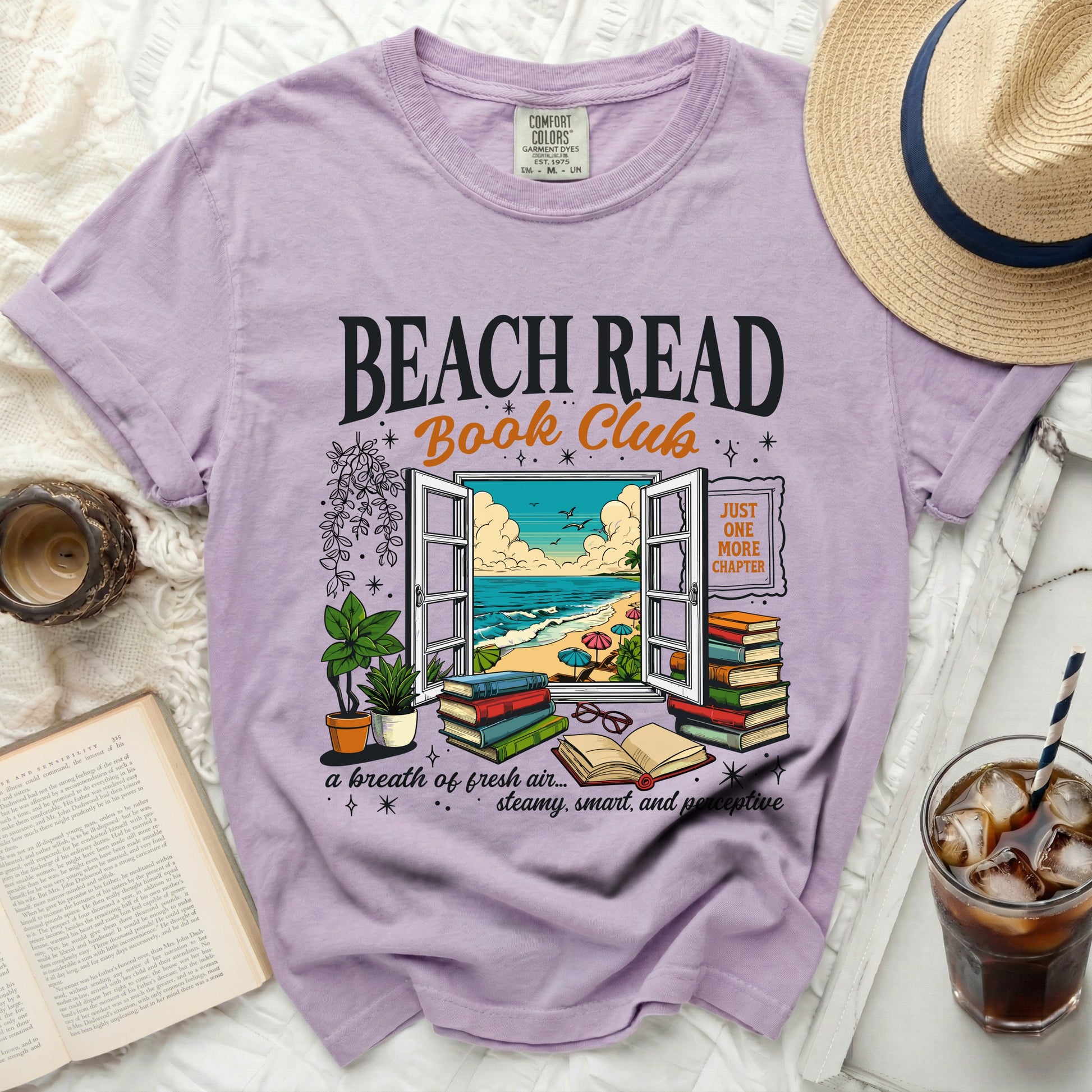Purple t-shirt with "Beach Read Book Club" text, featuring an open window scene.