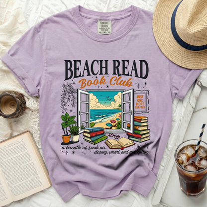 Purple t-shirt with "Beach Read Book Club" text, featuring an open window scene.
