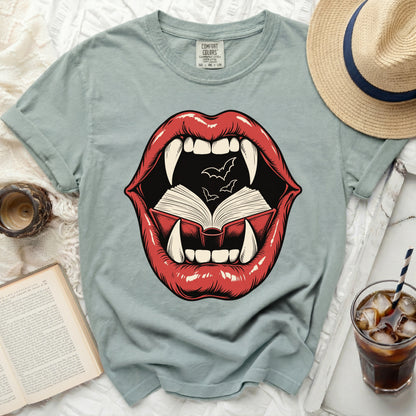 T-shirt with graphic of red lips opening to reveal a book and bats