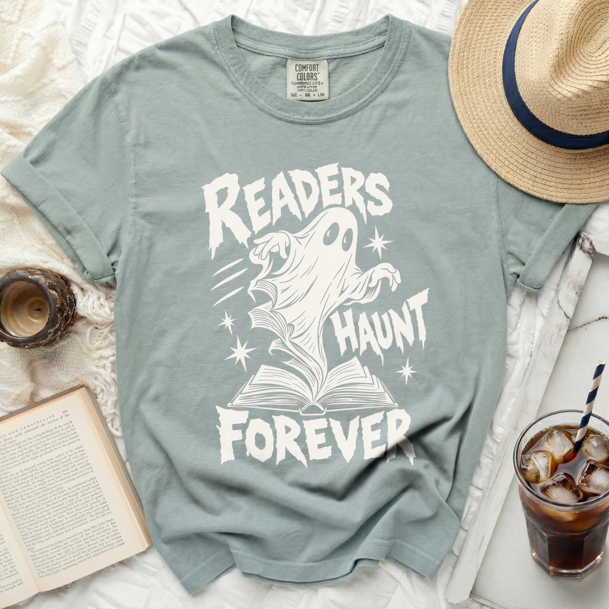 Ghost emerging from book saying "Readers Haunt Forever"