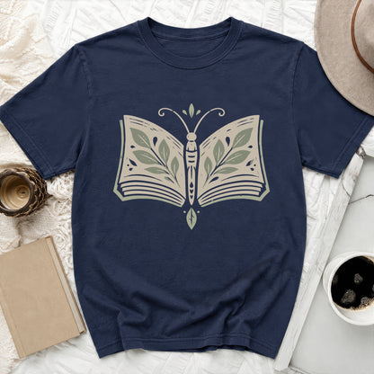 Navy t-shirt with a butterfly design made from an open book and leaves.