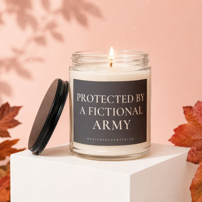 Glass candle with a burning wick and text "Protected by a Fictional Army".