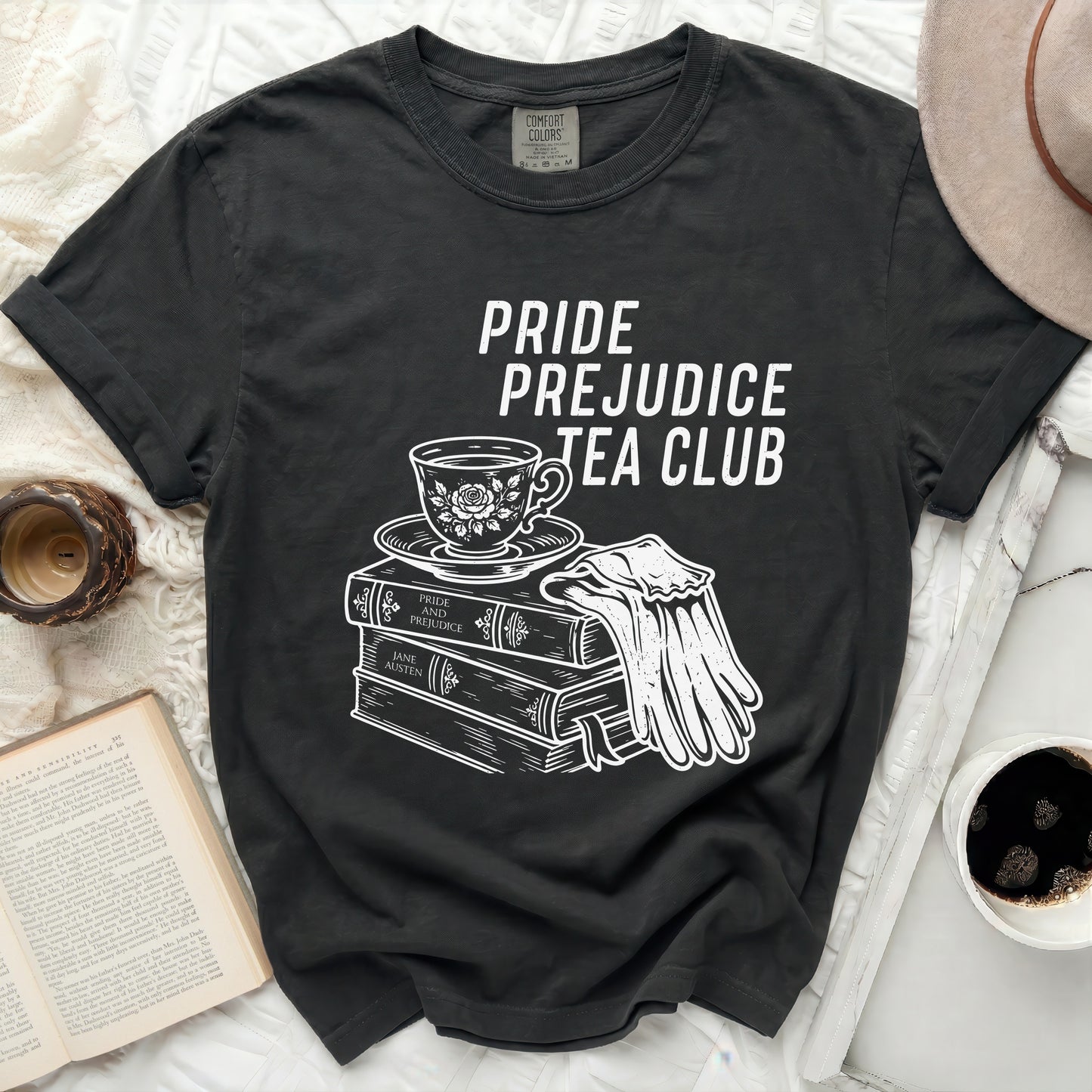 Black t-shirt with "Pride Prejudice Tea Club" text and book illustration.